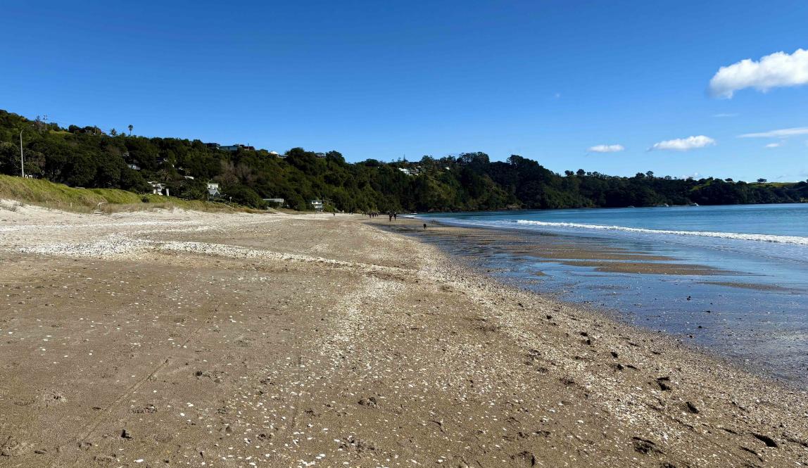 A shot of Onetangi beach taken from on the beach showing the expanse of the sand.