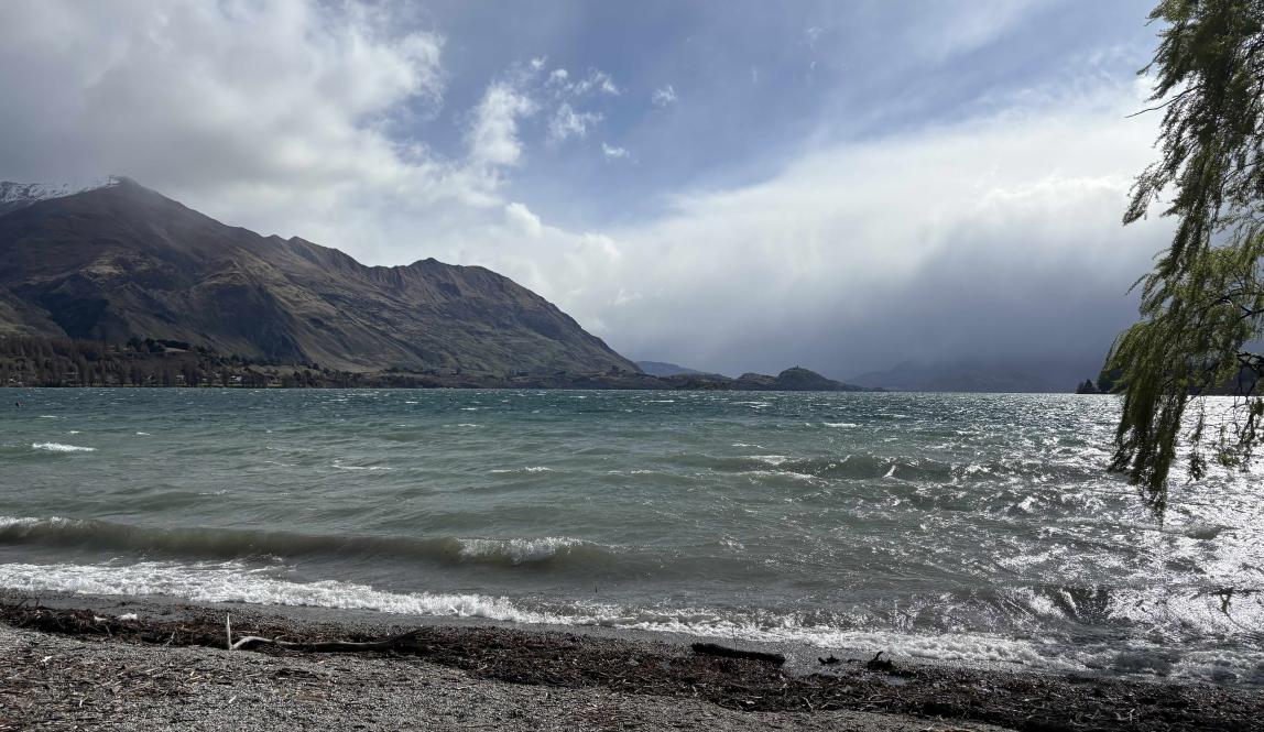 A beach view of the windy waves of Lake Wānaka.