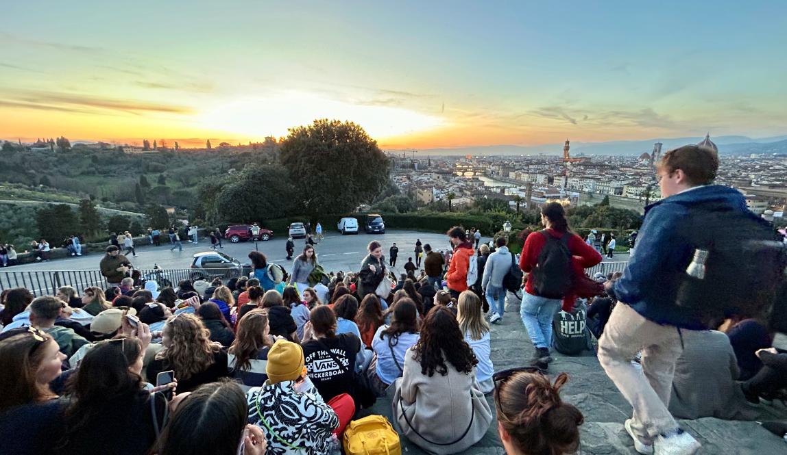 Group of students watching sunset in Florence, Italy