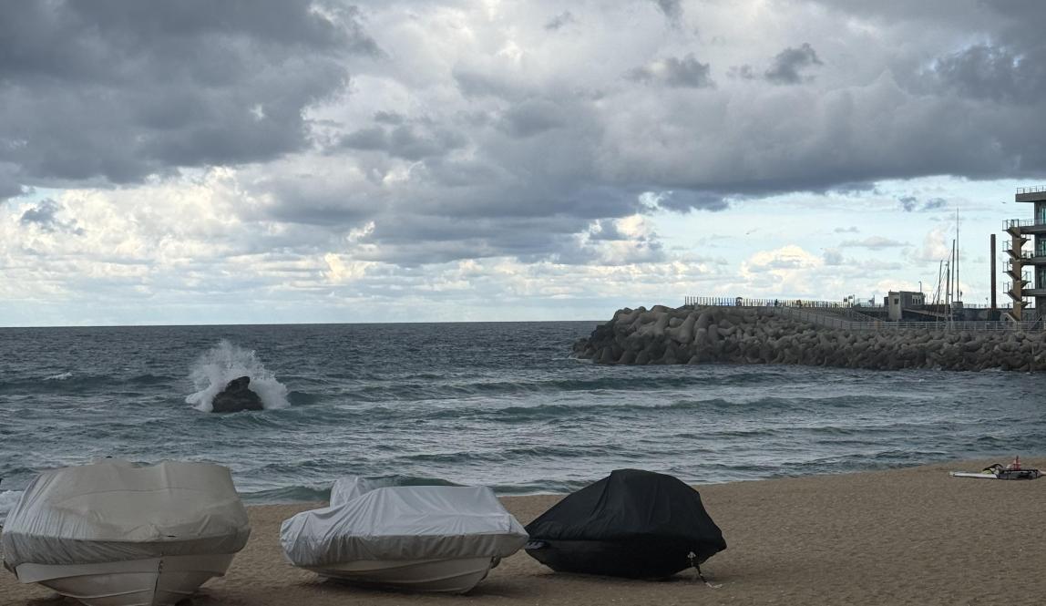 Beach with cloudy skies above