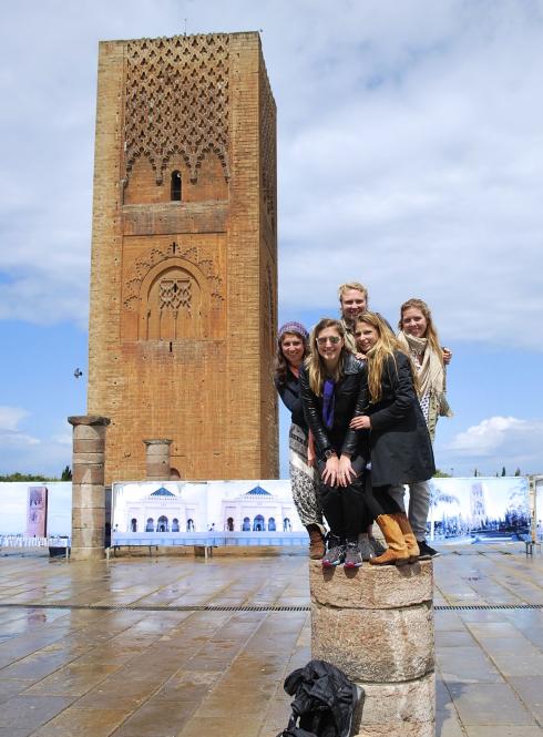 students standing on a pose in front of Hassan Tower in Rabat