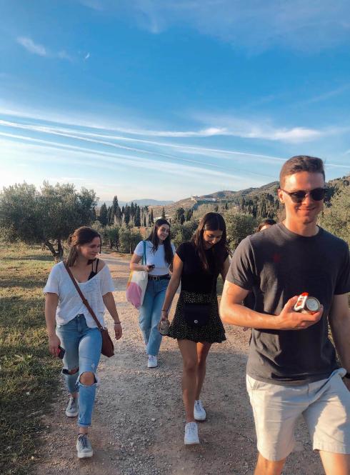 Four students walking along a path in Granada