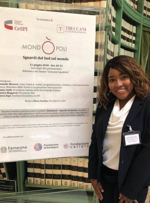 Student standing in Italian Parliament building
