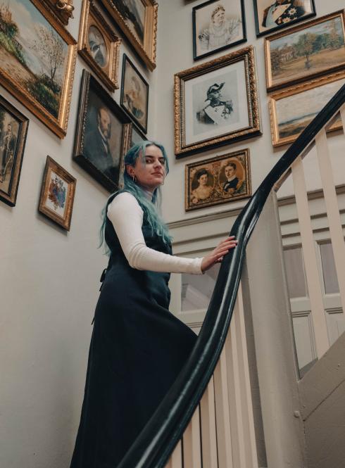 A student walks up the stars in the Gründerzeit Museum in Berlin, Germany.