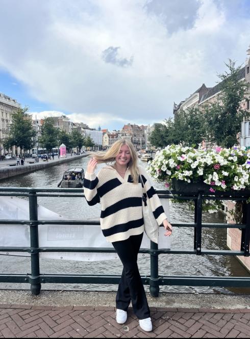 Katie standing on a bridge by the canal in Central Amsterdam