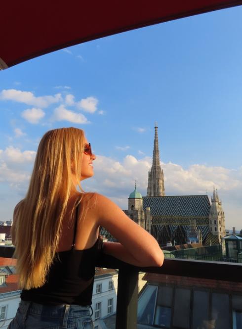 A girl looking out over the city of Vienna