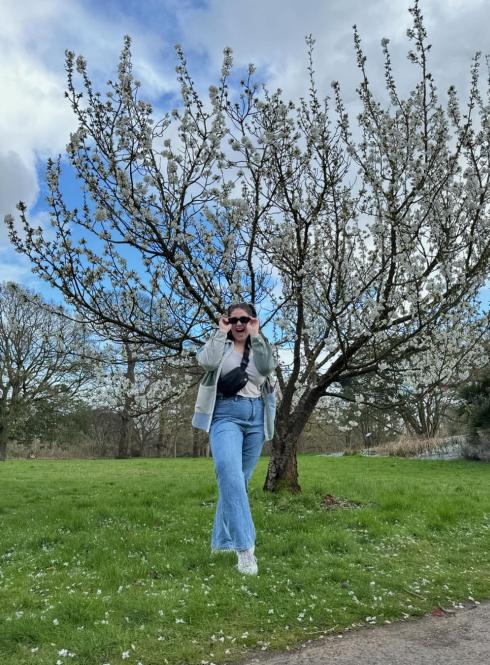 london student in front of tree