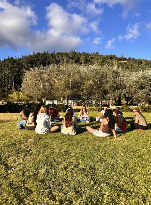 Students in Cape Town sitting in circle outside