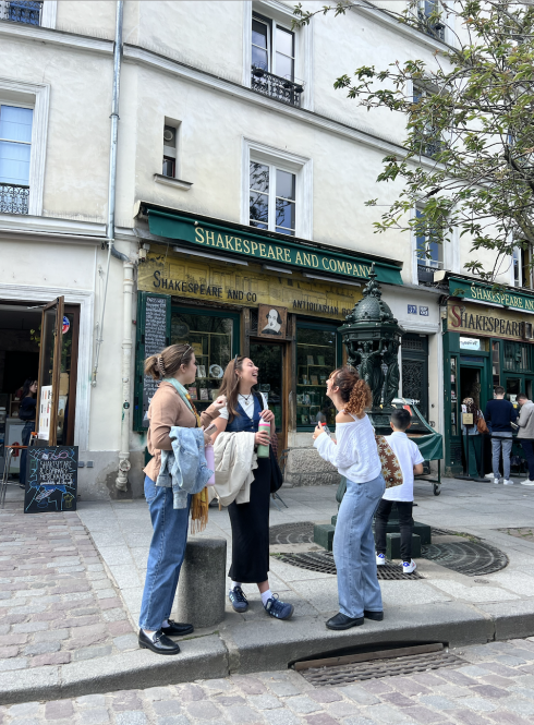 Paris students laughing outside of bookstore