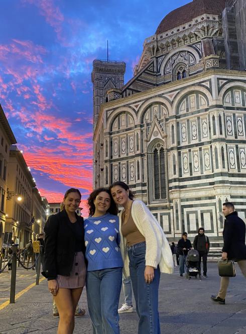 Friends at sunset in Florence, Italy in front of the Duomo