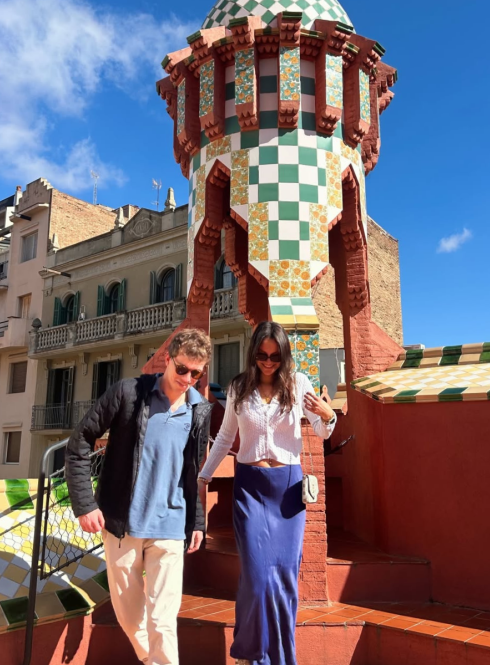 Friends on a sunny rooftop enjoying the unique architecture of Casa Vicens in Barcelona