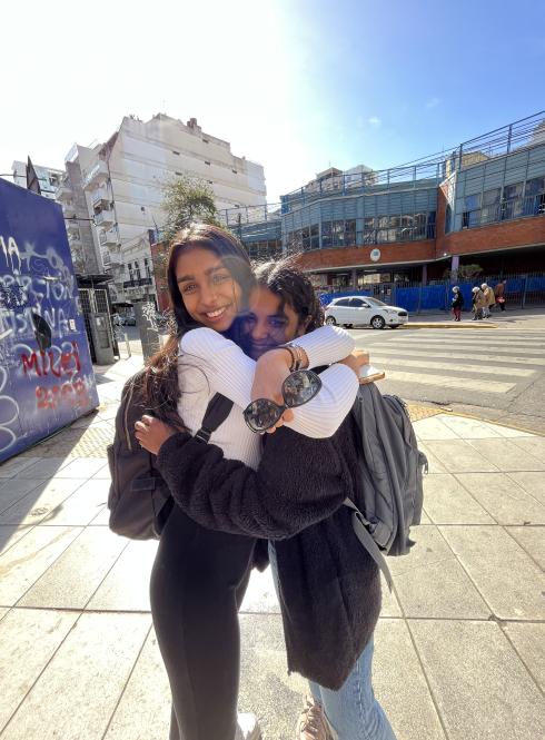 two students hugging and smiling in Buenos Aires