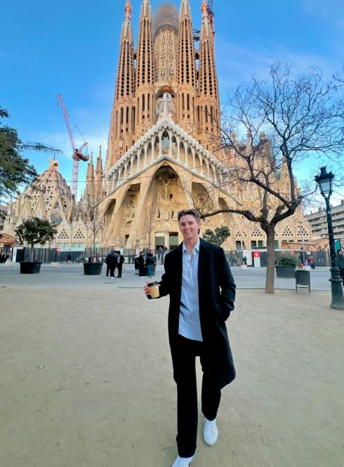 IES Abroad Barcelona intern on his way to work past La Sagrada Familia