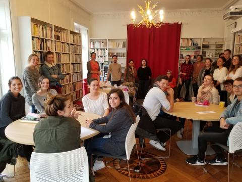 A group of French and American students at IES Nantes Conversation club in the library