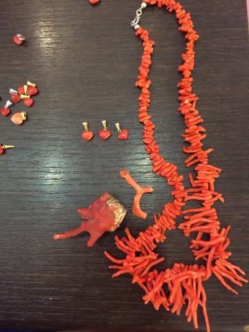 Large rock arch with a small boat passing through. This alt text was added with Al; accuracy may vary.