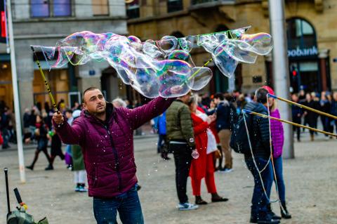 Giant Bubbles Entertain Crowds at Dam Square