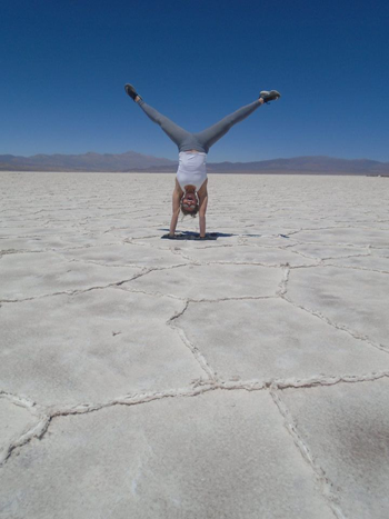 Peyton Tatonetti doing a handstand in the salt flats