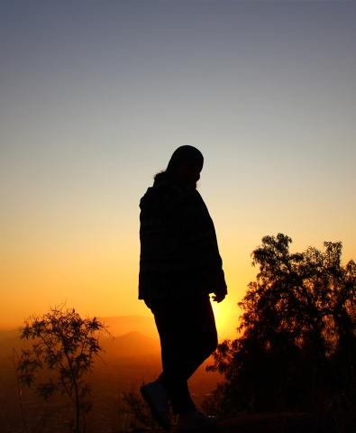 a student's silhouette during sunset in Santiago