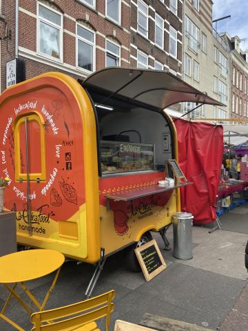 yellow and orange empanada food truck 