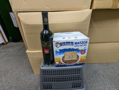 Image of a bottle of wine and a box of matzah