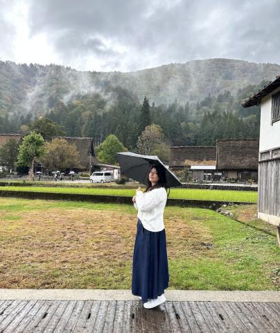 A picture of me in front of the mountains in Shirakawa.