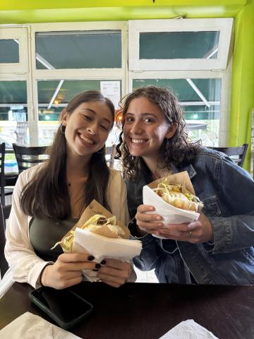 Two people holding up food