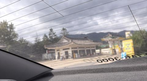 This is a photo of a gas station in Gyeongju with a hanok-style roof.