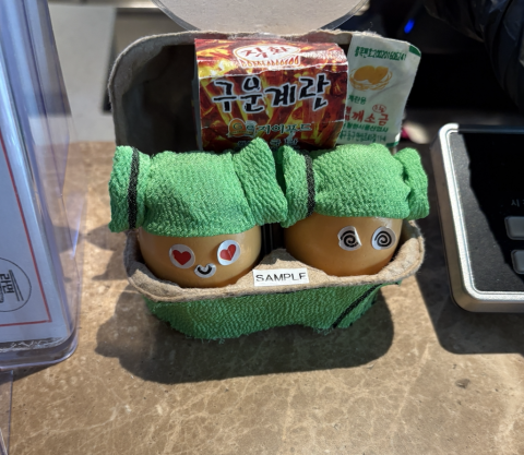 This is a photo of two boiled eggs wearing the Yangmori headwrap.