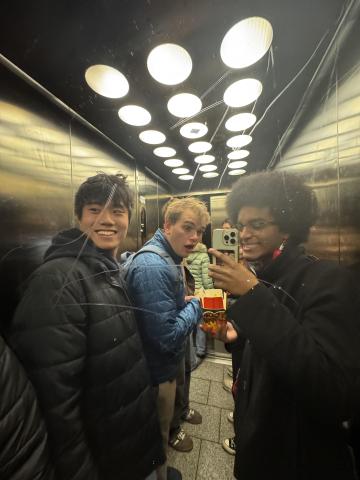 Friends taking a photo in an elevator