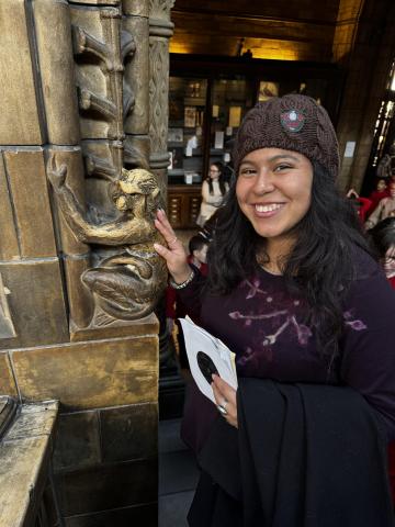 Woman petting monkey statue