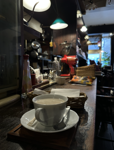 A coffee set on a dark wooden bar