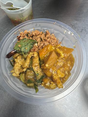 a bowl with thai curry, minced meat, and some vegetables
