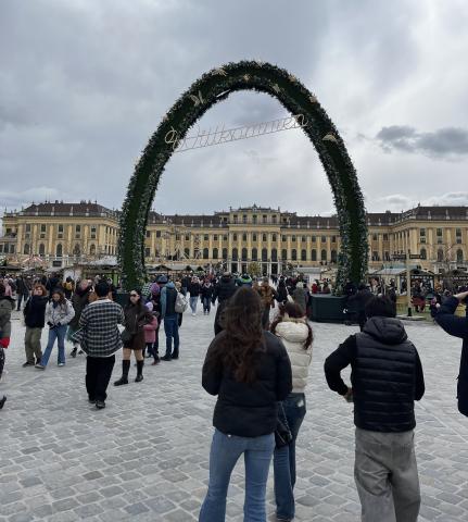 The winter fair at Schönbrunn Palace welcomes visitors with a gigantic wreath in front of the beautiful Baroque-style palace.