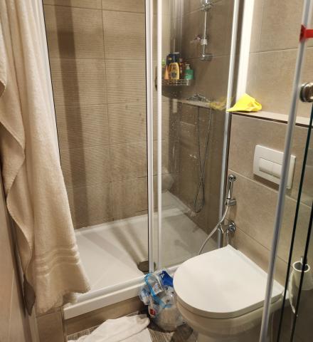 A bathroom with a sink, toilet, and shower inside a studio room at Collegiate Milan Bovisa.