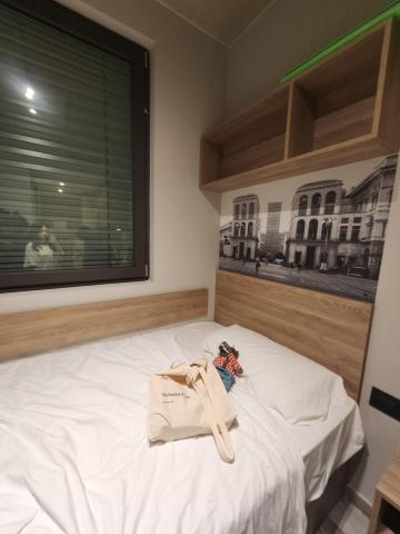 A bed inside a studio room at Collegiate Milan Bovisa