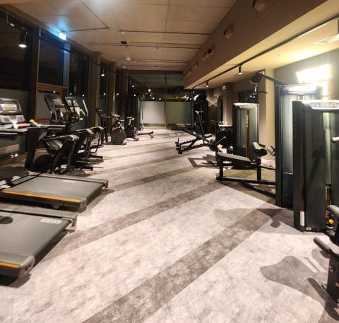 A student gym with workout equipment inside Collegiate Milan Bovisa.