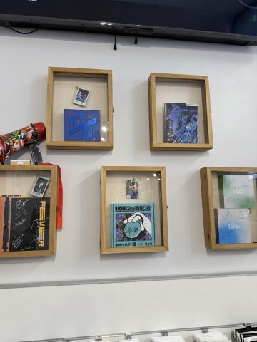 Photo of signed K-pop albums inside Kaido Italia