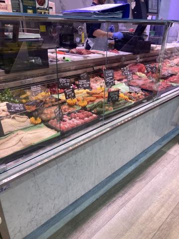 Photo of a meat counter in Italian supermarket