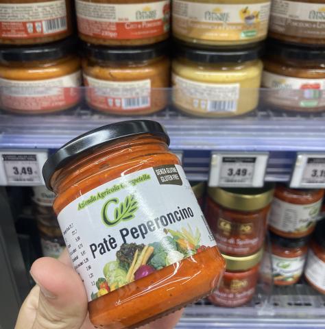 a jar of pepper paste, with other jars in the background