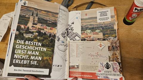 A page in my junk journal, with pamphlets and cards from the Klosterneuberg Mittelalterfest.