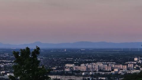 A view from Kahlenberg over Vienna with a beautiful sunset painting the sky a gentle red.