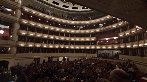 The huge inside of the historic Staatsoper while seats are filling in.