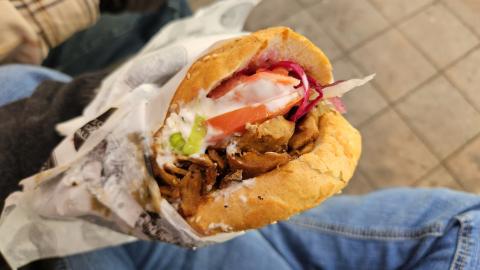 A sauce and vegetable packed Döner Tasche from Vienna's delicious Ugis.