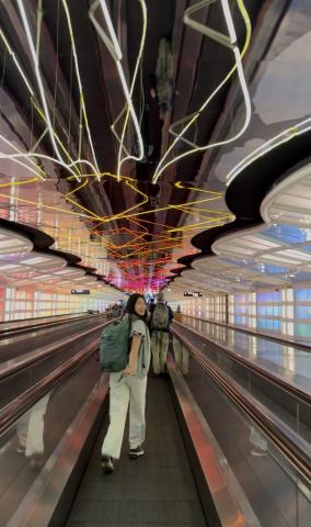 Eileen walking through the airport O'Hare