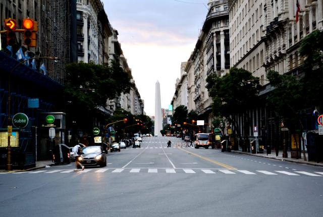 the obelisco sculpture in the center of a street in Buenos Aires