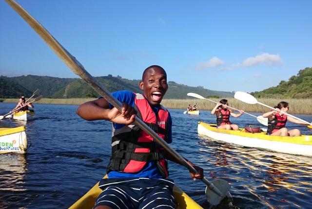 a student poses for a fun photo while kayaking in South Africa