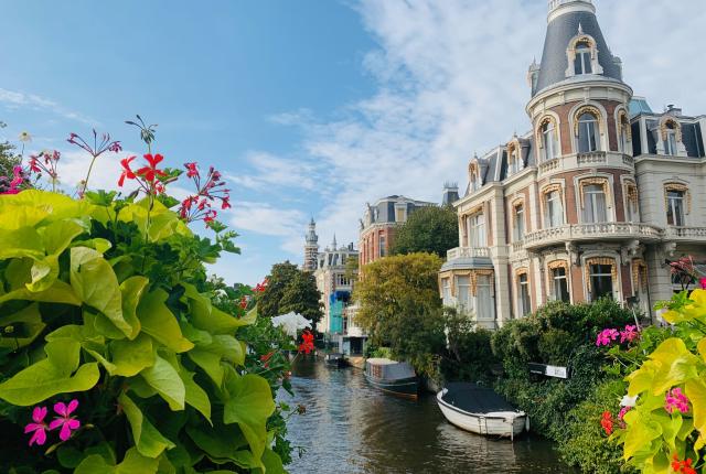 flowers in front of an Amsterdam canal and typical architecture