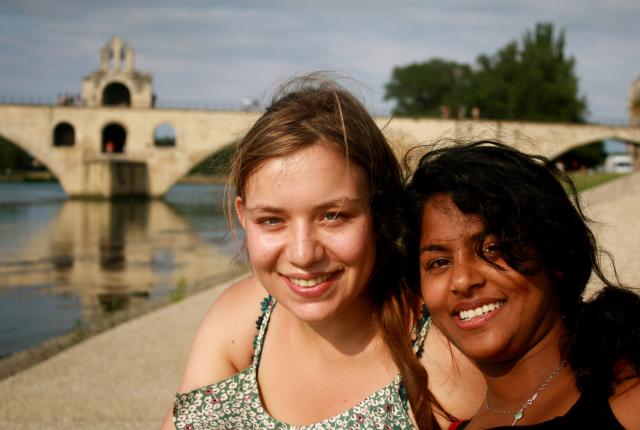 Two students sit by the water in Arles