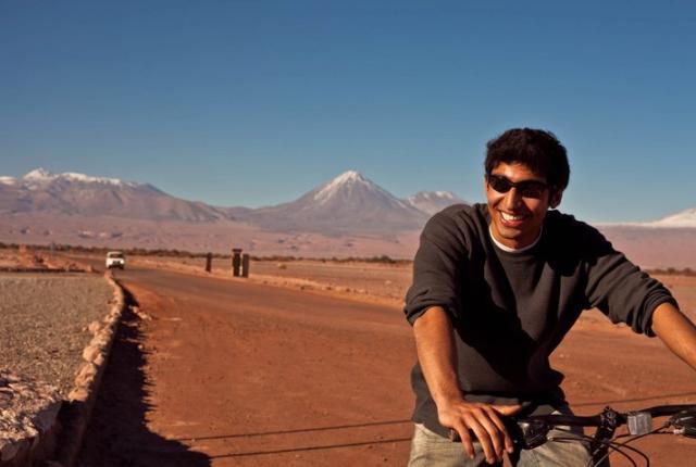 a student biking through Valle de la Luna in San Pedro de Atacama, Chile