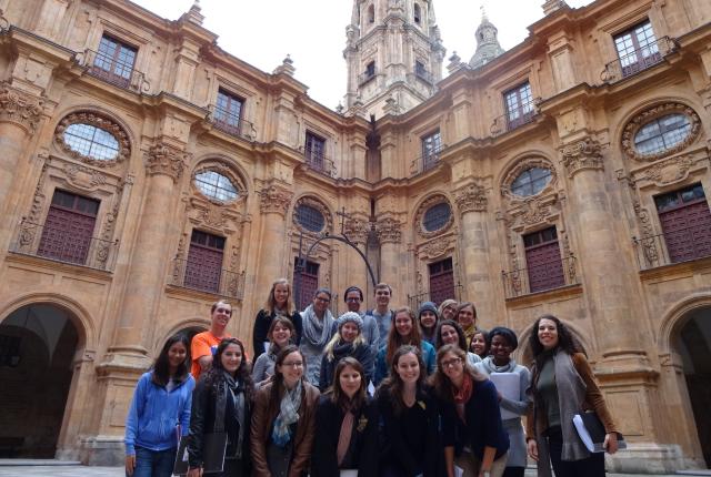 a group of students pose for a photo at Plaza Mayor in Salamanca